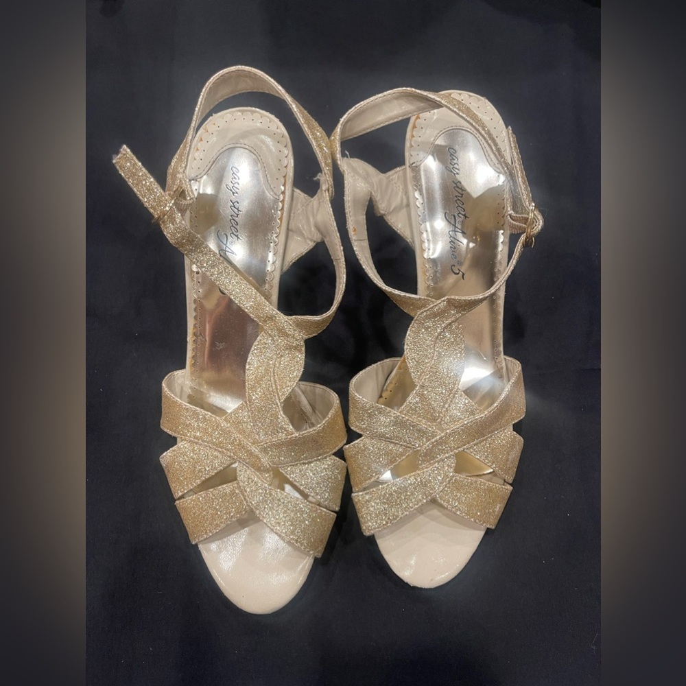 Woman’s gold heels